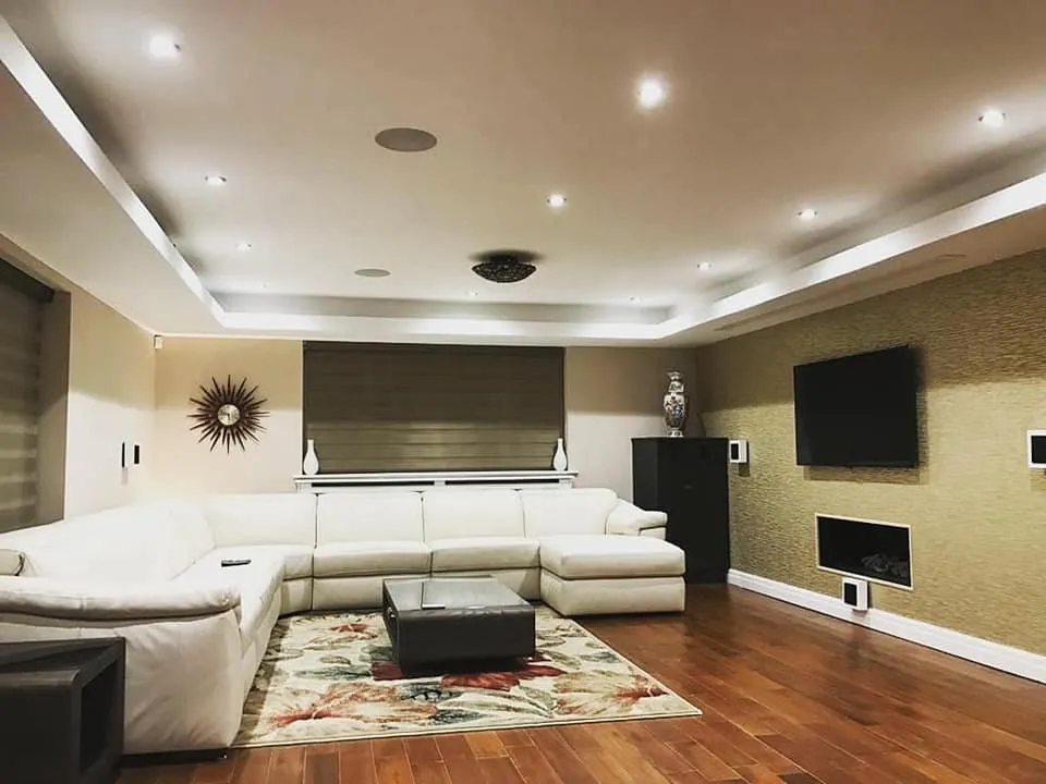 A living room with a large white couch.